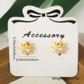 Minimalist gold star stud earrings with central white zircon on display card - Star Style