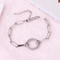 Silver interlocking paperclip chain bracelet with a central micro-pave round pendant - Round Platinum Plated Bracelet