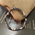 Detail of natural zebra stone beaded bracelet with rectangular facets and metal spacers - Black & White Stripes