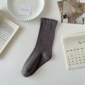 Dark grey mid-calf cotton socks displayed on a minimalist white table with decor - Dark Gray