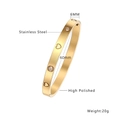 Polished gold stainless steel bangle with heart patterns and sparkling round rhinestones - Four Stones Six Hearts Gold