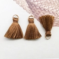 Three brown mini tassels with golden rings made of silk thread for DIY crafts - Coffee