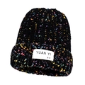 Black knit beanie with colorful speckles and woven label for winter warmth and style - Black