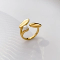 Detail of a gold pea-shaped crossover ring featuring a freshwater pearl and polished finish - US 6 / Leaf Freshwater Pearl Open