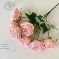 Pink artificial rose bouquet with green leaves on a clean white desk background - Light Pink