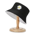 Black and white reversible bucket hat with embroidered daisy on wooden stand - One Size / Black