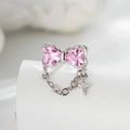 Silver bow earrings featuring pink heart stones and a delicate cross chain pendant - Pink Zircon (Single)