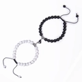 Detail of magnetic heart clasp connecting black stone and white turquoise bead bracelets - White Howlite + Matte Stone