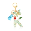Green floral resin letter K keychain with gold butterfly charm and blue tassel - Letter K