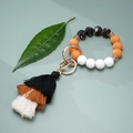 Orange and white floral silicone bead keychain bracelet with a tricolor cotton tassel - Orange Black Floral (#8)