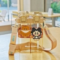 Brown dual-compartment cartoon water bottle with straw and adjustable carry strap - 750ml / Coffee (8805-1)