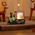 Macro detail of a vintage Christmas train lantern with glowing snowman and tree scenery - Red Train Snowman