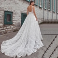 Elegant white lace bridal gown with backless design and long luxury train - US 26W / Trailing / White