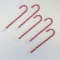 Detalle de cinco bolígrafos con forma de bastón de caramelo con rayas rojas y blancas - Sin Campana / Rojo