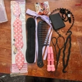 Pink hair styling tool set with sponge bun makers and hair loops on wooden surface - 14-Piece Combination / Multicolor