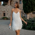 Detail shot of white fringe and feather hem on a stylish V-neck sequin cocktail dress - S / White