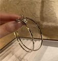 Silver round hoop earrings held by hand showcasing sleek metal luster and luxury style - Silver Metallic Large Hoop Style (E2361 Silver) / 925 Silver Needle / Silver