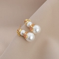 Detailed view of pearl snowman earrings with red crystal hat and scarf festive jewelry - Gold