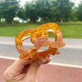 Tortoiseshell acetate hair claw clip with gold glitter and twist knot design - Pretzel (Approx. 8cm)