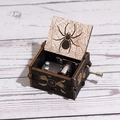 Black wooden Halloween hand-crank music box with golden bat and skull patterns - Hand-cranked Halloween F