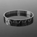 Detailed close-up of dark grey gunmetal bangle with geometric triangular textures - Engraved Triangle Bangle Black