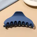 Detailed macro view of large matte dark blue shark hair claw clip with strong grip design - Dark Blue Matte-Crescent