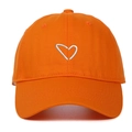 Detail of vibrant orange baseball cap with white embroidered heart on cotton twill fabric - Orange