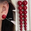 Glossy red bead stud earrings in a variety of sizes displayed on model and jewelry tray - 4163-1.2cm Red Bead Stud