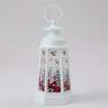 Close-up of a white Christmas lantern featuring Santa Claus and reindeer graphics - Santa Claus / White