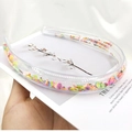 Transparent PVC headband filled with colorful fruit sequins, held against a soft background - Soft Clay Fruit Style