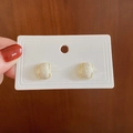 Elegant gold-framed cream rectangular gemstone stud earrings with a pearlescent finish - White Curved Square