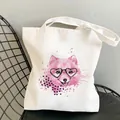 Detail of white canvas tote featuring a cute pink dog with heart glasses and polka dot bow - Pink Fox with Heart Glasses