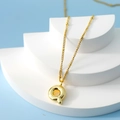 Golden bubble letter Q pendant necklace with a polished finish on a minimalist stand - Letter Q(Q)
