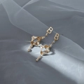 Matte gold letter B earrings with twisted metal and zircon on blue silk fabric - Gold Letter B Dangle Earrings