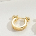 Detailed view of U-shaped gold nose ring with sparkling pavé cubic zirconia accents - U-Shaped
