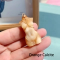 Orange calcite female torso pendant wrapped in gold wire with a leather cord - Calcite/Metal / 4cm Orange Calcite