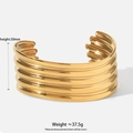 Detail shot of golden wave texture on 30mm wide open stainless steel bangle - Wave Texture Wide Style (A1156) / Gold