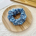 Royal blue hair scrunchie with white daisy floral pattern and elastic pleated design - Blue Floral