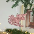Sparkling rose gold sleigh Christmas tree ornament with glitter finish and white ribbon - Sleigh Style B
