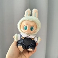 Labubu plush toy accessory featuring a green rabbit hat and blue denim overalls outfit - Two-piece Set With Denim Overalls / First And Second Generation Keychains Are Compatible With La Cloth Dolls. Dolls Not Included.