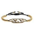 Gold beaded bracelet with star and lightning bolt pendant on adjustable black cord - Black Rope + Gold Copper Beads