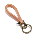 Vintage brown leather keychain with bronze horseshoe buckle on a clean white background - Natural