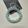 Mint green spiral telephone wire hair tie with a fresh summer lucky clover design - Polka Dot Moss Green