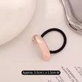 Minimalist elastic hair tie with rose gold curved metal plate in a modern polished finish - Single Layer Arc Rose Gold