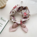 Chic cotton linen square scarf with pink floral and red lip print in stylish knot - Floral Person
