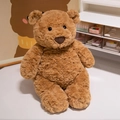 Orsetto di peluche marrone seduto con pelliccia riccia su un tavolo bianco - Orsacchiotto / 25cm