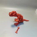 3D printed T-Rex dinosaur skeleton articulated model toy with bone accessory in red finish - Red