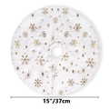 Detail view of a 15-inch white plush Christmas tree skirt with gold snowflake patterns - 39cm Diameter / Gold Snowflake