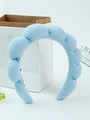 Light blue sponge cloud headband made of soft towel fabric on a white surface - Sky Blue