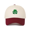 Detail of leaf clover embroidery with lucky script on a color-block trucker cap - Adjustable / Cream/Wine Red